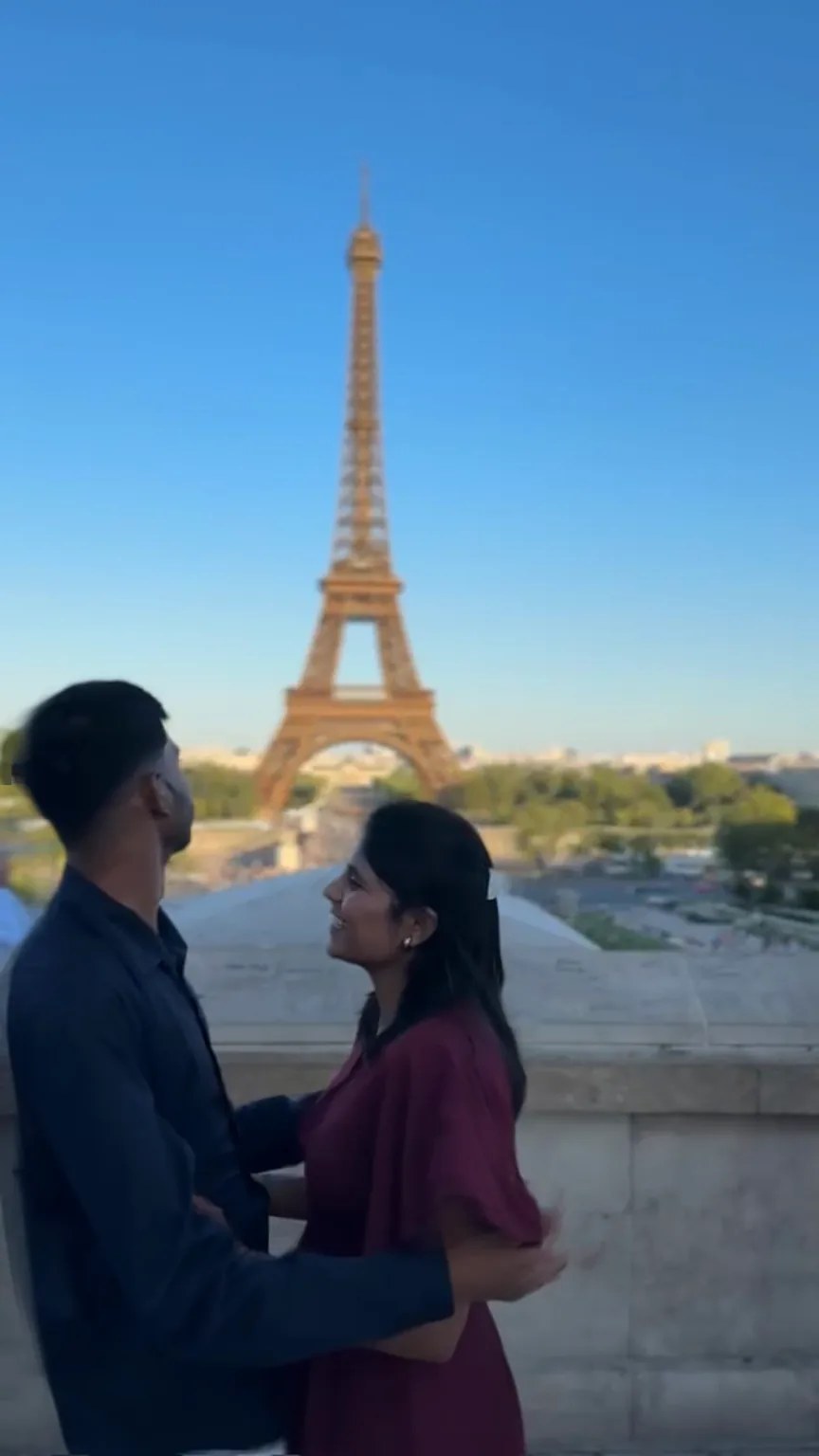 Prem and Soniya in front of the Eiffel Tower
